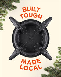 Top down view of the Tree Mate Christmas tree stand showing its clamping bolts and sturdy base